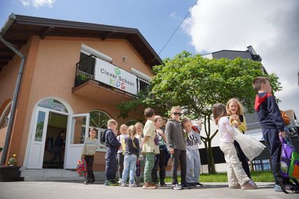 Pupils lining up outside the Clever School building in Novi Sad
