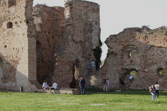 Pupils exploring medieval fortress ruins on a school trip