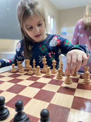 Pupil playing chess at Clever School