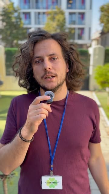 Clever School staff member speaking into a microphone in the school yard